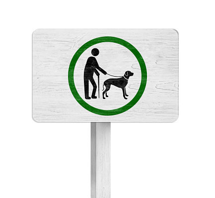 Wooden sign board ALL PETS MUST BE ON A LEASH on white background