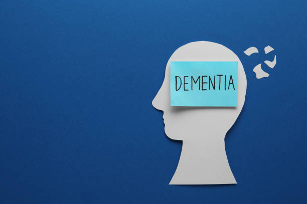 istock Human head cutout with word Dementia on blue background, flat lay. Space for text 1463556147