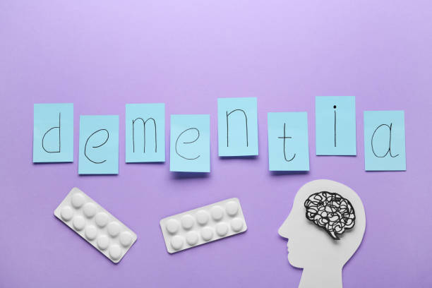istock Flat lay composition with word Dementia on violet background 1463556256