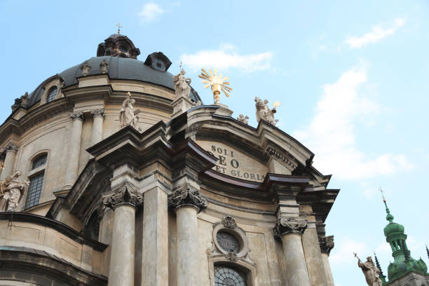 istock LVIV, UKRAINE - MAY 2, 2022: Beautiful Dominican Cathedral against blue sky, low angle view 1463556846