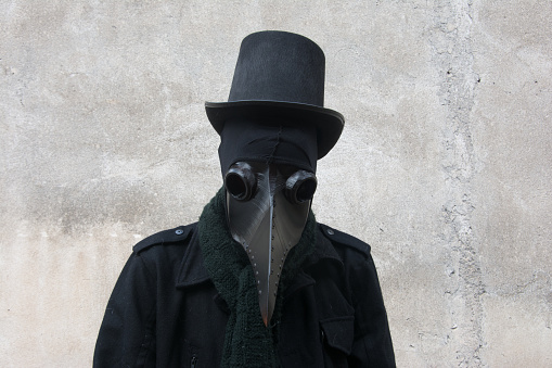 Closeup photograph of doctor plague with gray background