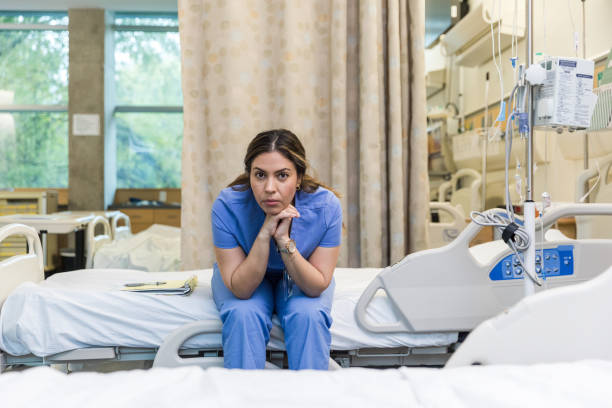 istock Serious female intern looks at camera during break 1463564261