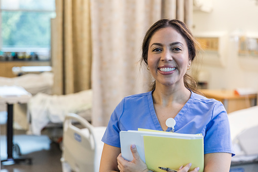 A photo of a cheerful nursing student with a big beautiful smile.