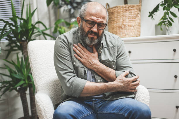 Mature adult man in home interior ( negative emotion) stock photo