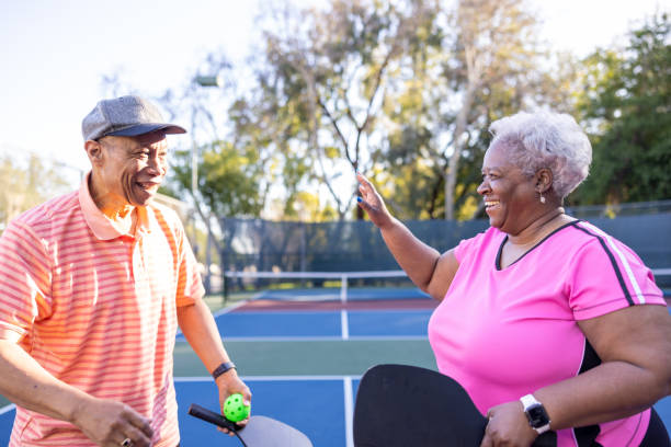 istock Senior Black Couple Playing Pickleball 1463570232