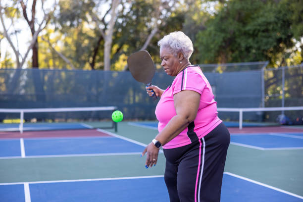istock Senior Black Couple Playing Pickleball 1463570242