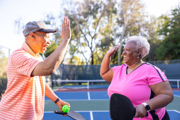 istock Senior Black Couple Playing Pickleball 1463570248
