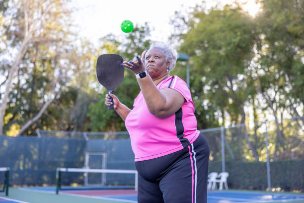 istock Senior Black Couple Playing Pickleball 1463570337