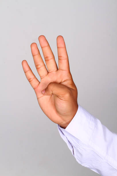 istock Business Man Hand shows number four 1463570352