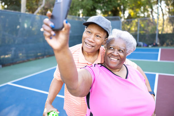 istock Senior Black Couple Playing Pickleball 1463571197