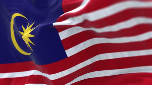 Detail of the Malaysia national flag waving in the wind