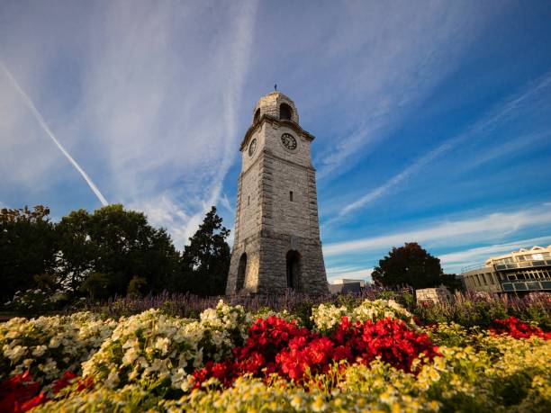 Historical stone clock tower War Memorial on Seymour Square surrounded by colourful flowers in Blenheim New Zealand Historical stone clock tower World War Memorial on Seymour Square surrounded by colourful flowers in city center of Blenheim Marlborough South Island New Zealand marlborough new zealand stock pictures, royalty-free photos & images