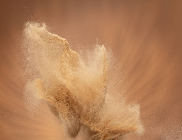 Small Fine size Sand flying explosion, Golden grain wave explode, abstract cloud fly. Yellow colored sand splash throwing in Air. Aura wallpaper background high speed shutter, freeze stop motion Small Fine size Sand flying explosion, Golden grain wave explode, abstract cloud fly. Yellow colored sand splash throwing in Air. Aura wallpaper background high speed shutter, freeze stop motion dust storm stock pictures, royalty-free photos & images