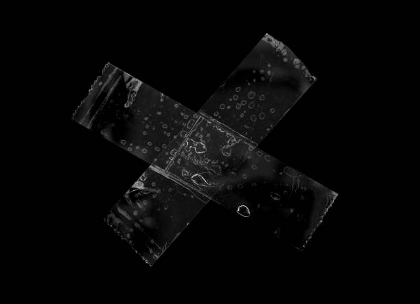 istock adhesive plastic tape isolated on black background 1463589767
