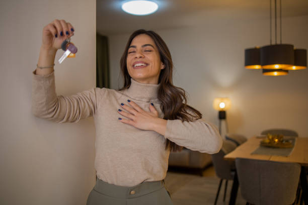 istock Woman moving into a new apartment 1463590566