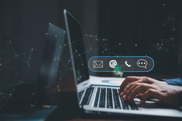 istock Customer support hotline contact us people connection concept. Web page online customer service technology idea. Businesswoman using computer with email, call phone, address, Chat message icons. 1463593523