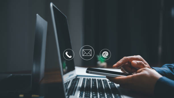 istock Customer support hotline contact us people connection concept. Web page online customer service technology idea. Businesswoman using smartphone with email, call phone, address, Chat message icons. 1463593526