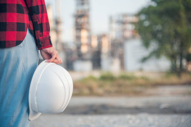 istock Woman construction engineer wear safety white hard hat at construction site industry worker. Female engineer worker civil engineering with hard hat safety helmet. Woman construction Engineer concept 1463629710