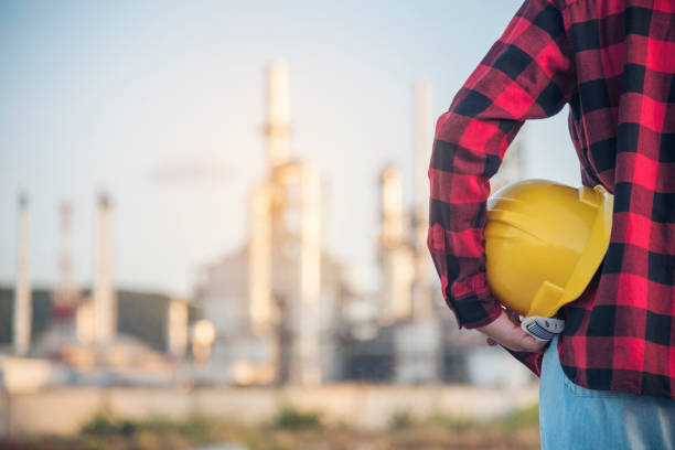 istock Woman construction engineer wear safety white hard hat at construction site industry worker. Female engineer worker civil engineering with hard hat safety helmet. Woman construction Engineer concept 1463629711
