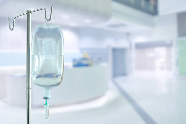 istock saline bag and hospital blurry background 1463630983