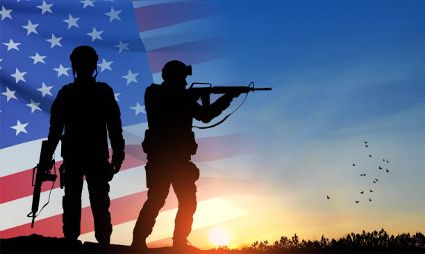 istock Silhouettes of soldiers against the sunset 1463631156