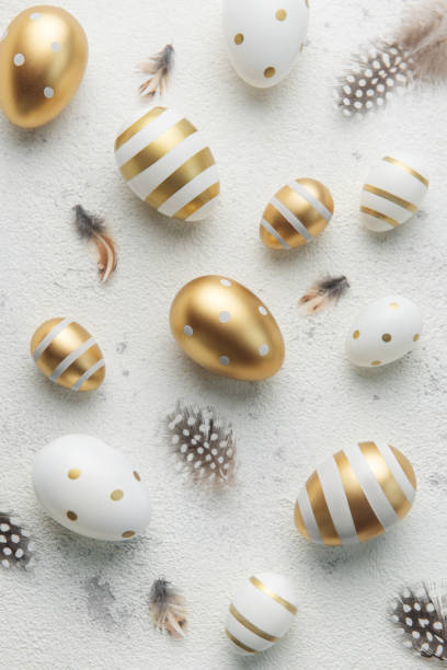istock Easter eggs are painted with gold paint on a gray concrete  background. 1463638763