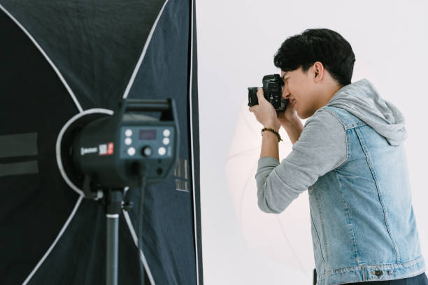 istock Asian Photographer shooting in Studio 1463640345