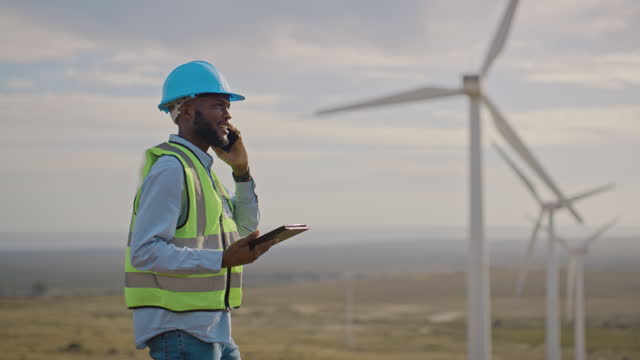Wind turbine, black man and phone call with tablet for engineering, construction and industrial architecture. Contractor, renewable energy and digital technology for sustainable electricity industry