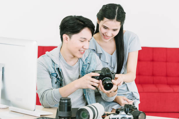 istock Asian Photographer and model looking pictures from camera 1463641406