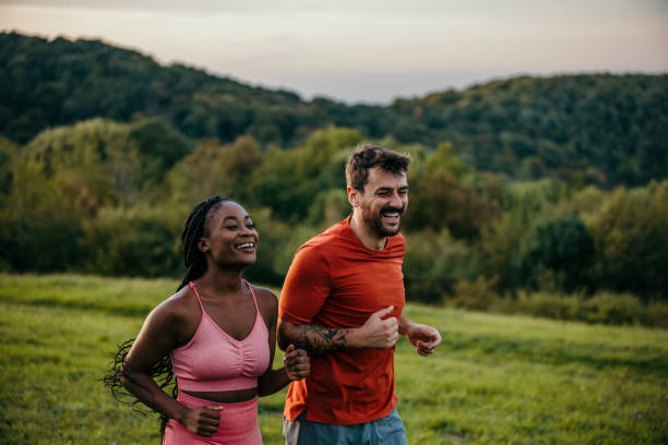 istock Smiling diverse couple jogging 1463643118