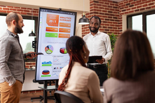 istock African american entrepreneur showing business graph 1463648614