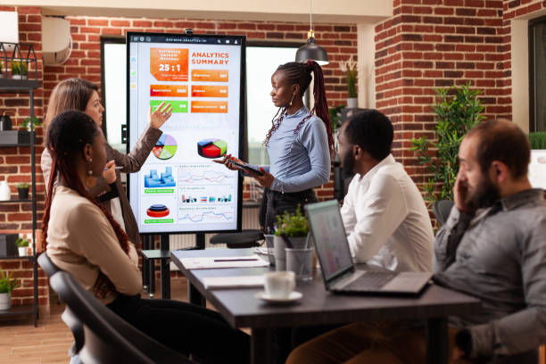 istock Diverse businesspeople working at management presentation 1463648647
