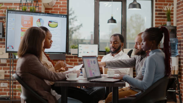istock Business people working together to plan marketing project 1463650569