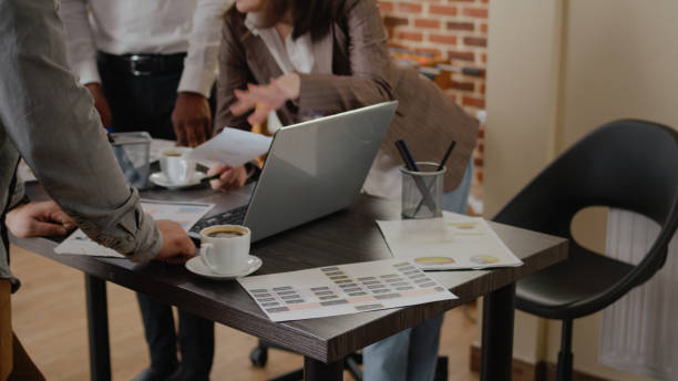 istock Close up of diverse group planning business project and strategy 1463650708
