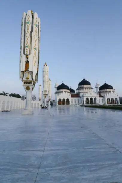 magnificent and beautiful view of the sunrise at the Baiturahhman grand Mosque in Banda Aceh, Indonesia.