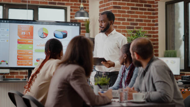 istock Business man with tablet presenting financial analysis 1463650840