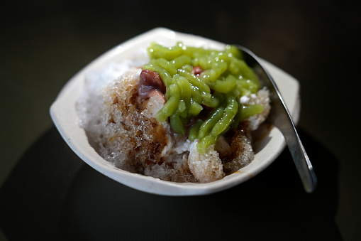 Cendol is an iced sweet dessert that contains droplets of green rice flour jelly, coconut milk and palm sugar syrup