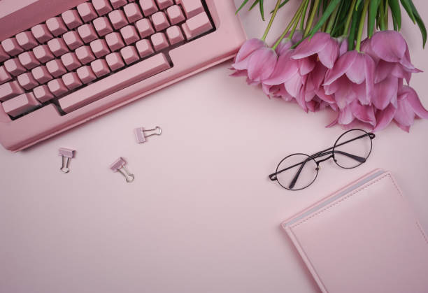 istock There is a typewriter on the table and there is a bouquet of tulips. 1463657760