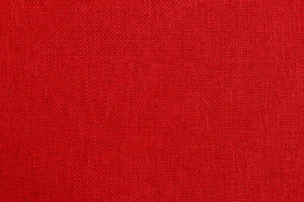 Dark red fabric cloth texture background, seamless pattern of natural textile.