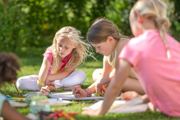 istock Girls drawing in garden 1463662032