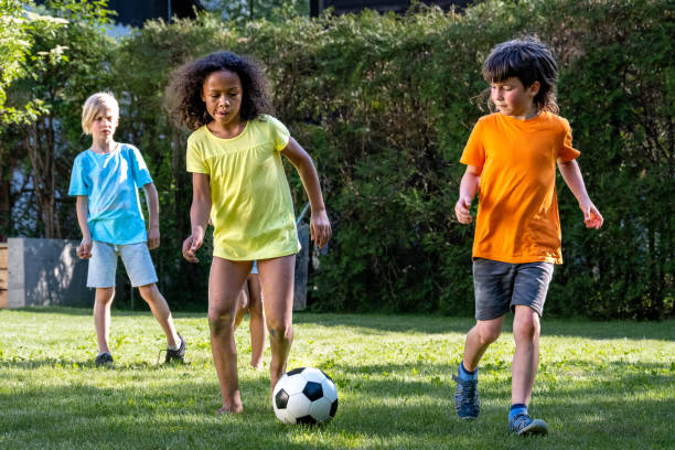 istock Children playing football 1463662044