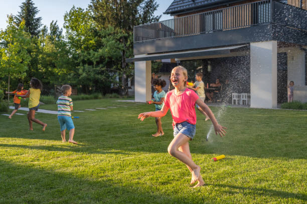 istock Children playing with water guns 1463662070