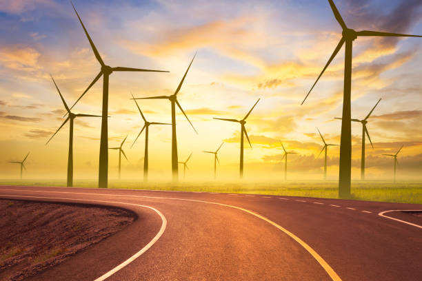 istock road and wind turbine at sunset 1463662407