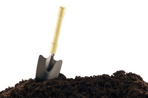 shovel and soil isolated on white background