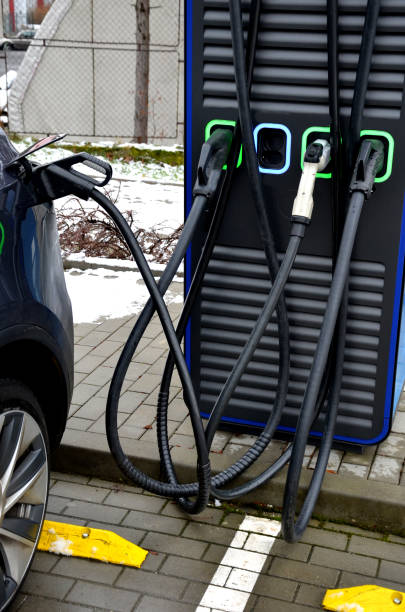 istock charging batteries in car can be a problem in the cold and snow. cables between vehicles can cause problems in parking lot when shoveling snow or tripping pedestrians. children should not touch 1463666125