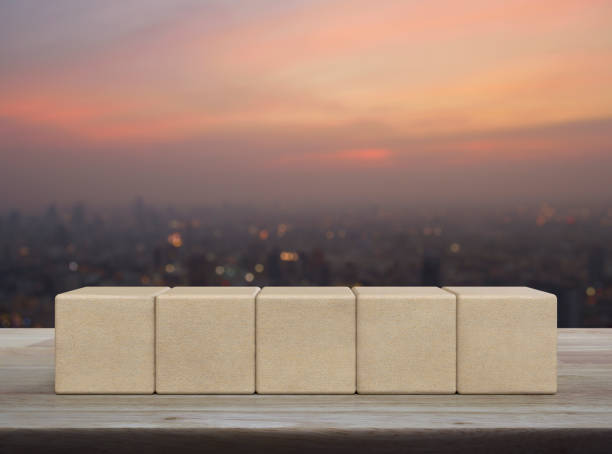 istock Five wood block cubes on wooden table 1463668299