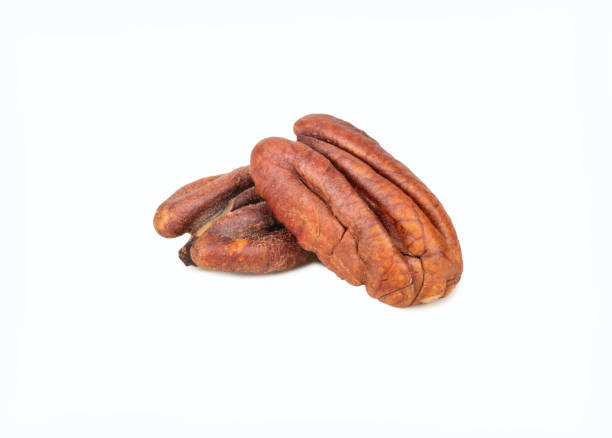 istock Two halves of dry pecan isolated on white background 1463670298