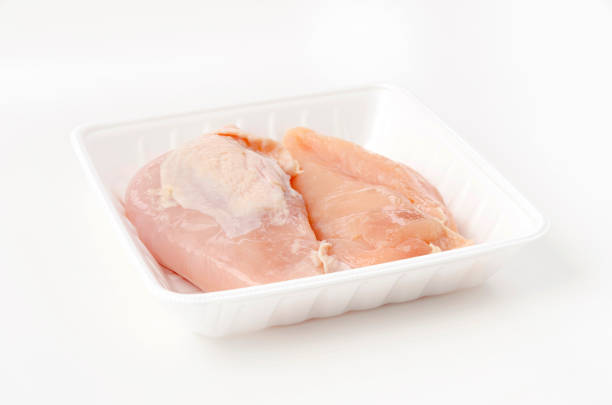 istock Raw Chicken breast on a foam tray on a white background 1463677968