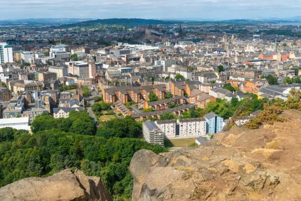 Cityscape of the Capital city of Scotland,with famous landmarks such as Edinburgh Castle with stage set for the Royal Tattoo,during Fringe Festival and Scott Monument.
