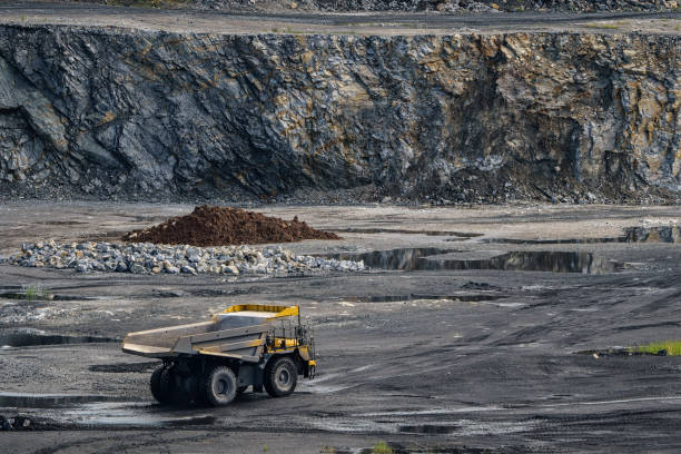 istock Dump truck in limestone mining, heavy machinery. Mining in the quarry. 1463682083